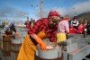 A Herring Girl taking part in a demonstration at The Herring Era Museum