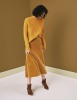 Oasis Ochre Raakel Ribbed Jumper, £40; Mid Yellow Bias Cut Skirt, £32; Tiger Boots, £45/AED203.12